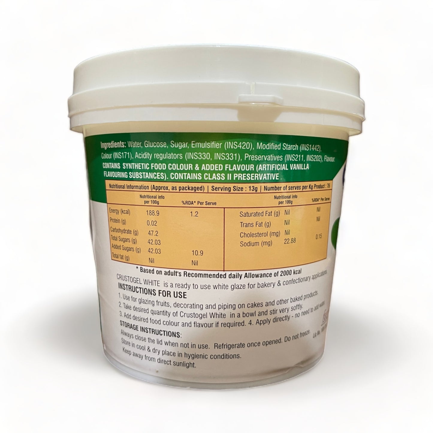 a cup of beer sitting next to a blender