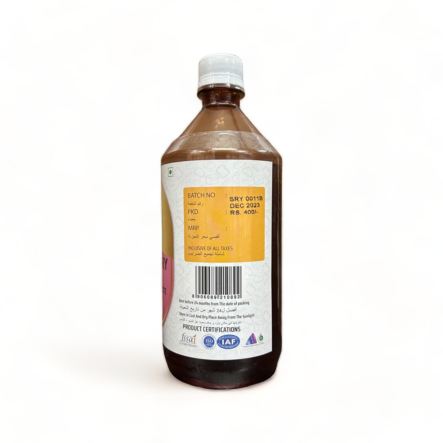 a cell phone sitting on top of a bottle