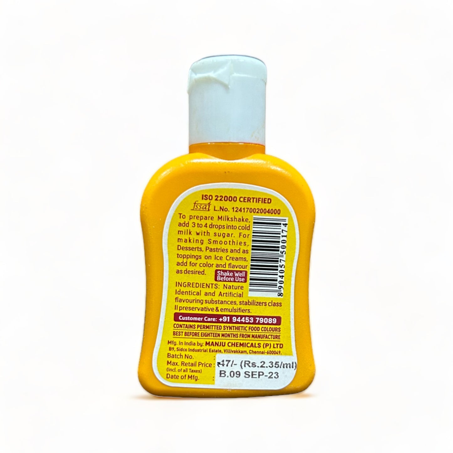 a yellow cell phone sitting on a yellow surface